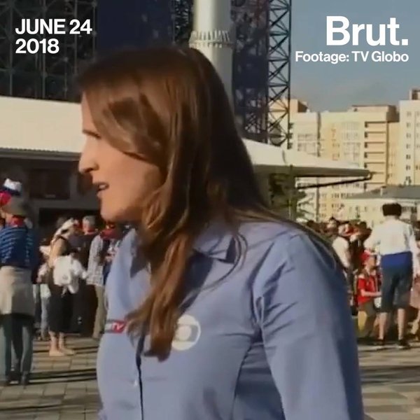 Brazilian reporter dodges football fan's kiss